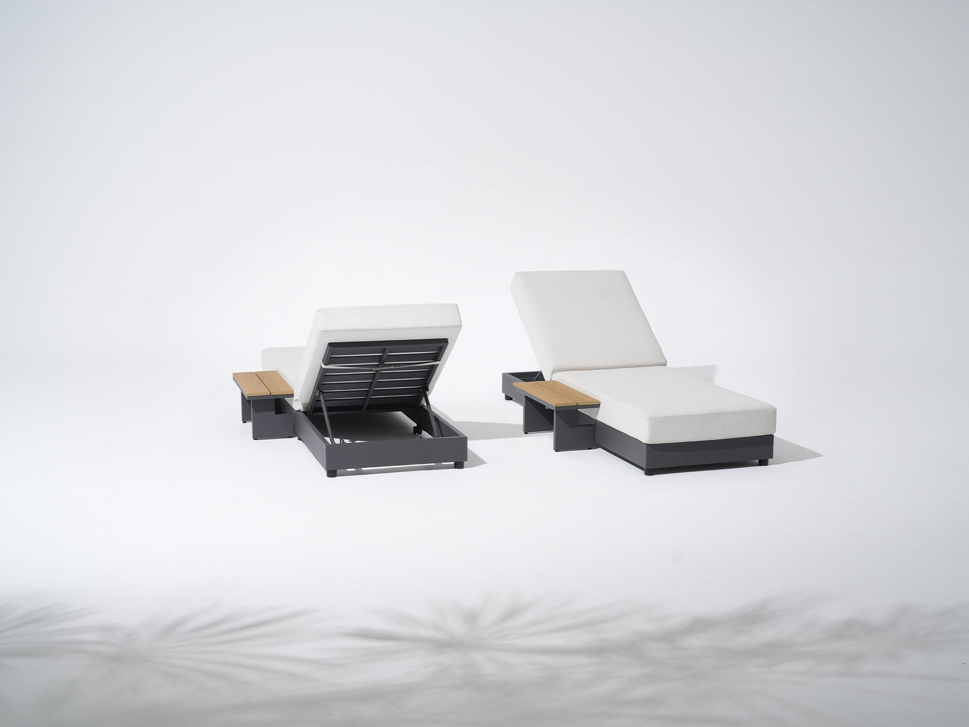Two modern lounge chairs with white cushions and black frames- Jardina Premium Modern Outdoor Patio Furniture