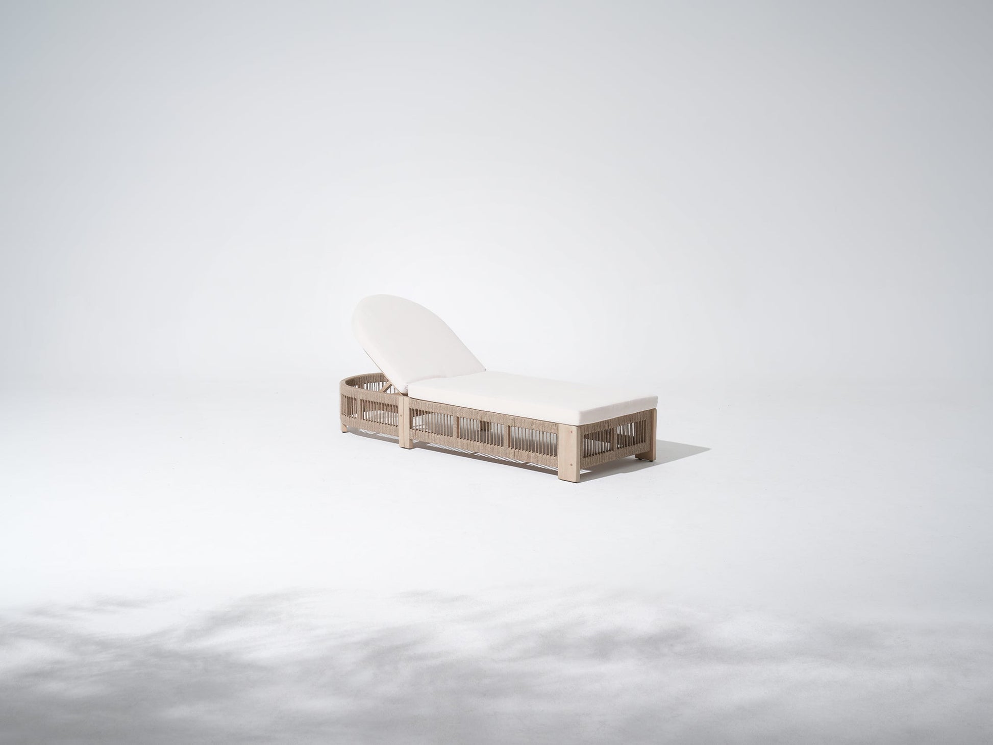 Minimalist outdoor lounge chair with wooden frame and white cushion